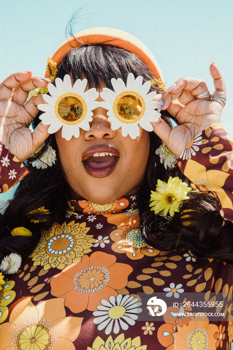 closeup of plus size Black woman’s face with sunflower sunglasses