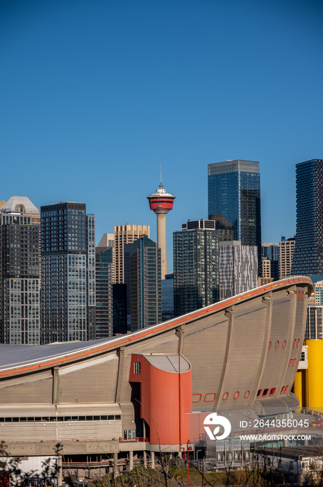 Calgary’s modern skyline with blue sky.