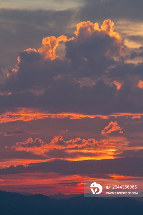 Colorful cloud patterns with golden hour light.