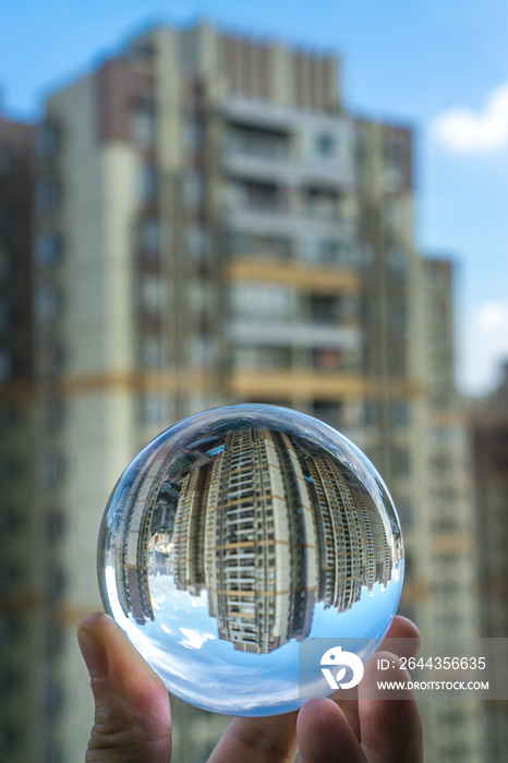 round Glass ball with big city buildings background