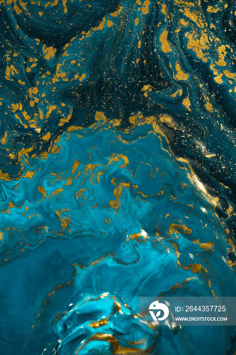 Abstract paint texture art. Natural luxury. Blue paint with gold glitter powder. Marble background.