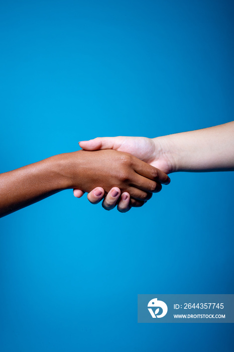 Close up of hands of friends greeting each other