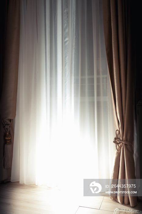 Curtains and closed blinds with bright back light