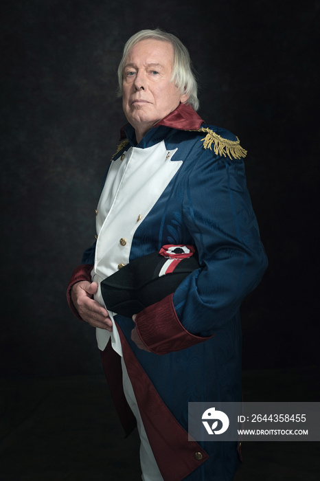 Official portrait of senior man dressed in historical emperor co