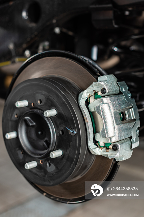 Close up view of assembled disk brakes with brake caliper