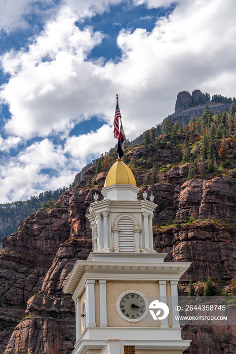 The clock tower of the historic walsh library in downtown Ouray Colorado.  City offices are located here.