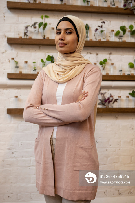 Portrait of woman wearing headscarf in flower shop