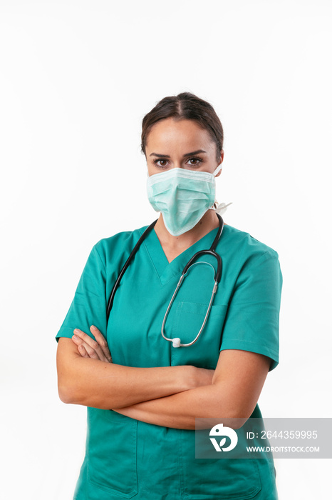 Beautiful female doctor in green uniform. Portrait of nurse with mask