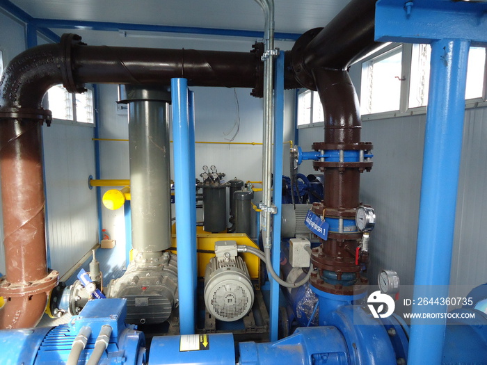 high-pressure pumps engines and pipes, water or wastewater treatment facilities inside or indoors, industrial interior