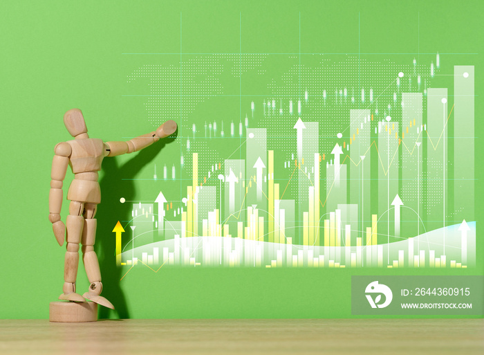 Wooden mannequin and graph with growing. indicators on a green background. Analysis of financial indicators in business