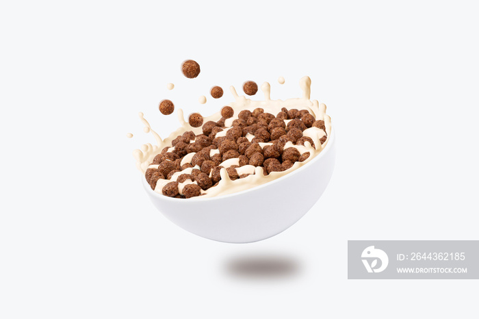 breakfast snacks fall into bowl with milk. File contains clipping path