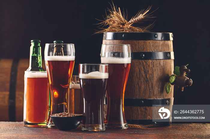 Composition with glasses of beer on dark background