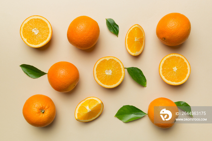 Fruit pattern of fresh orange slices on colored background. Top view. Copy Space. creative summer concept. Half of citrus in minimal flat lay