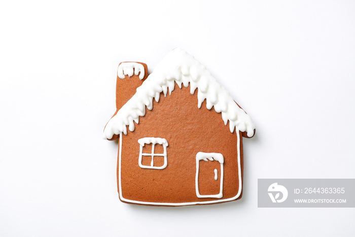 The hand-made eatable gingerbread house on white background