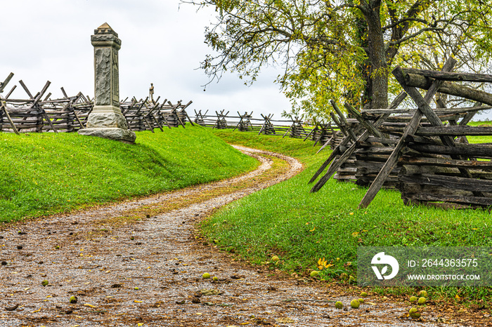 Country road, wooden fences, and tree during autumn on the Antietam battlefield