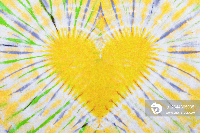 yellow heart sign tie dye pattern on cotton fabric background.