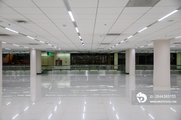 White empty corridor with lighting and glass window