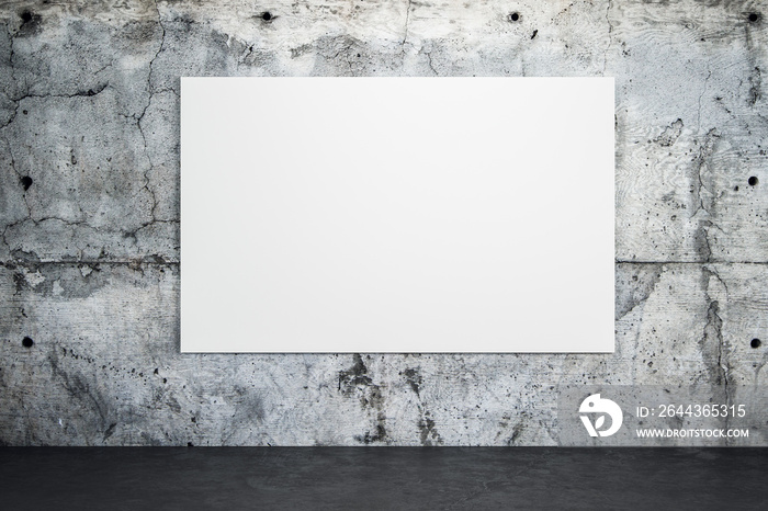 Blank white poster on loft concrete wall with dark concrete floor.