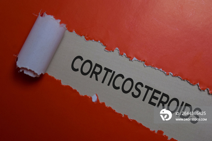 Corticosteroids Text written in torn paper. Medical concept