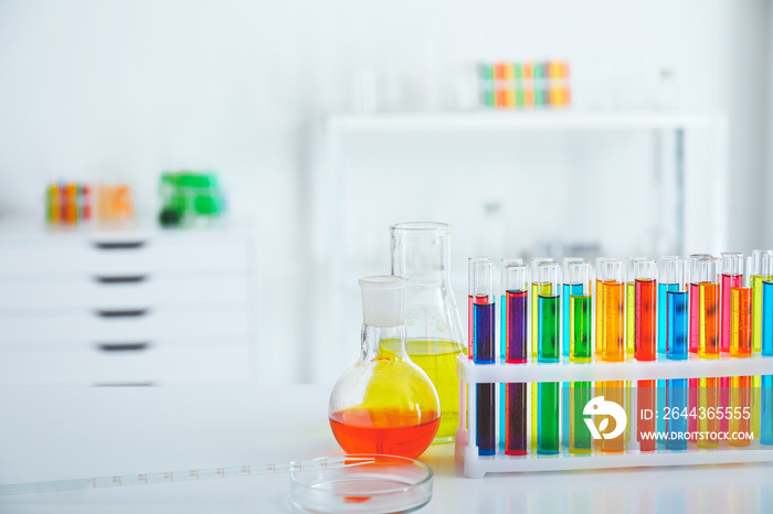 Glassware with colorful samples in laboratory