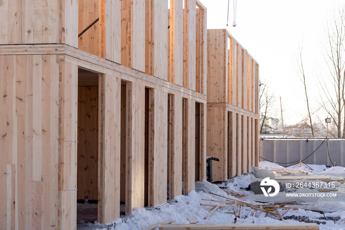 The process of building a new modern modular house from composite sip panels in winter.