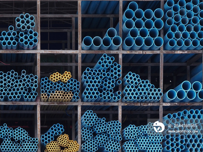 PVC pipes with steel pipes in warehouse.