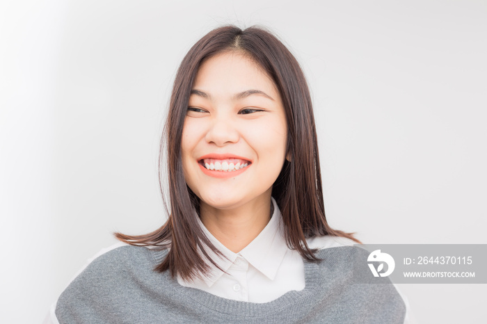 Beautiful young asian women smiling on white background