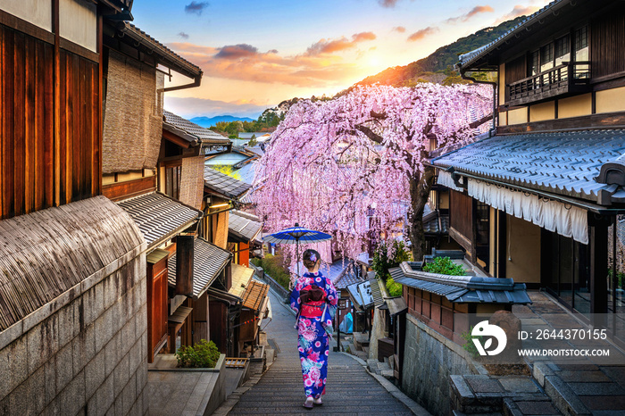 Woman wearing japanese traditional kimono walking at Historic Higashiyama district in spring, Kyoto in Japan.