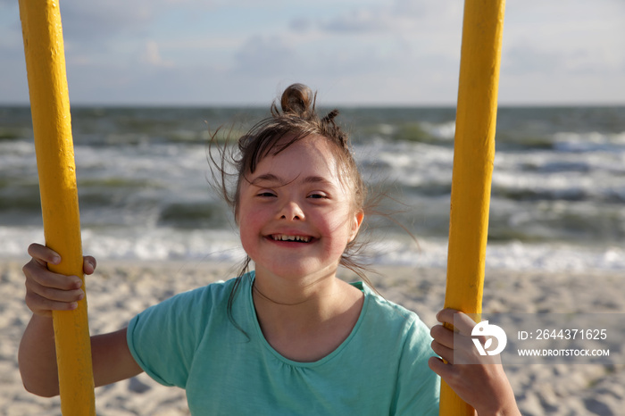 Little girl having fun on the swing