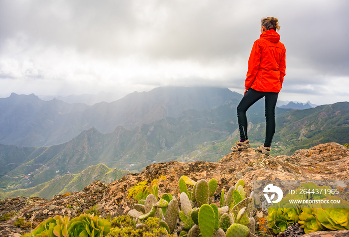 Sporty woman hiking in Anaga Mountains Taganana Tenerife, Canary island resort.