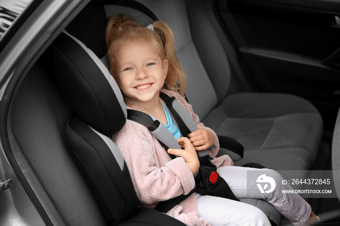 Cute girl on backseat in car