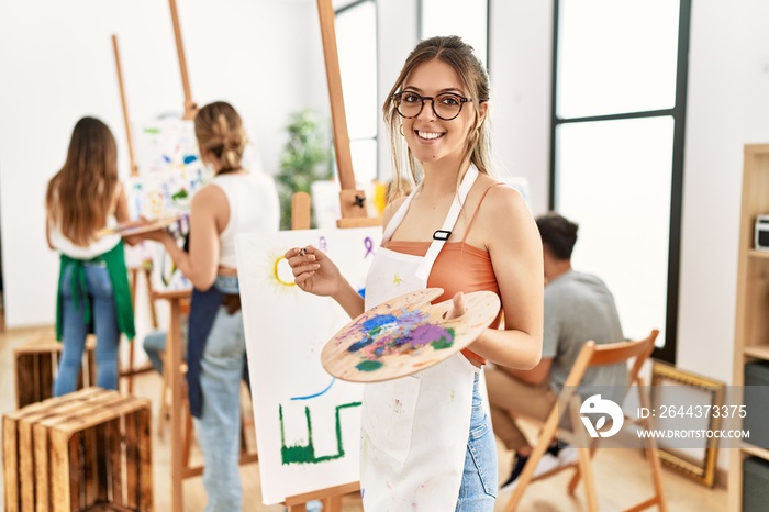 Group of young people smiling happy drawing at art studio