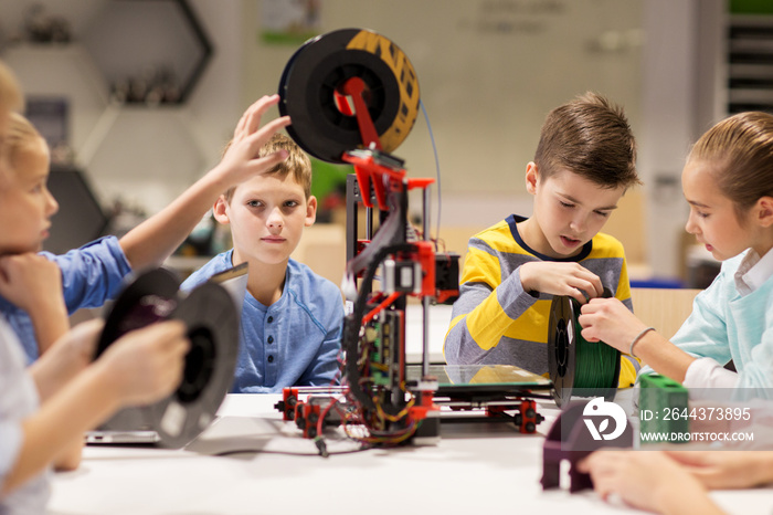 happy children with 3d printer at robotics school