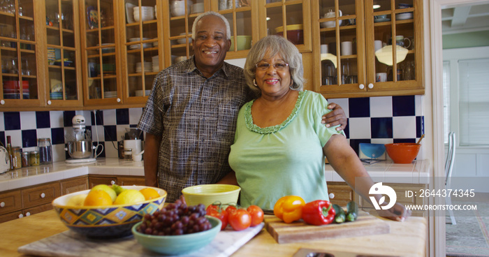 Happy mature black couple in the kitchen