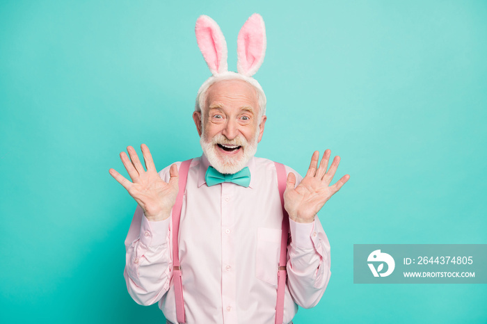 Portrait of funky crazy excited old man look incredible easter party discounts impressed scream wow omg wear pink outfit hare headband isolated over teal color background