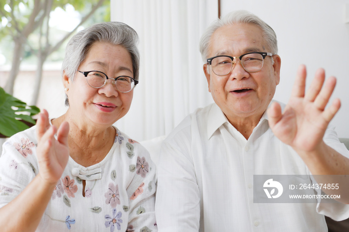 POV couple Asian old senior grandfather and grandmother video call virtual meeting with family