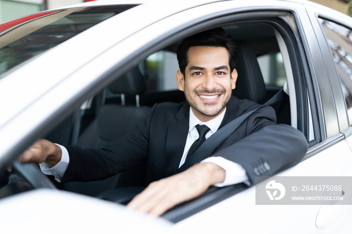 Smiling Businessman Driving Car