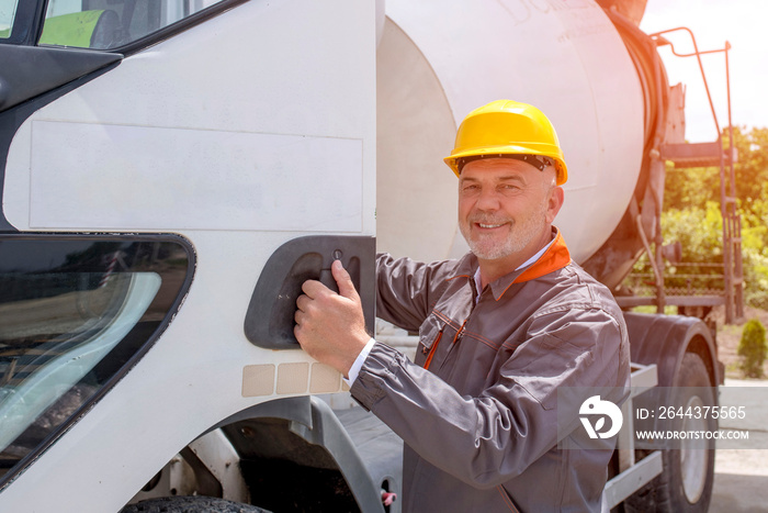 Concrete mixer truck driver with hardhat