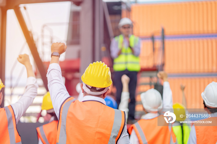 Teamwork engineer technician and foreman and safety helmet in cargo container shipping area, Work successful.