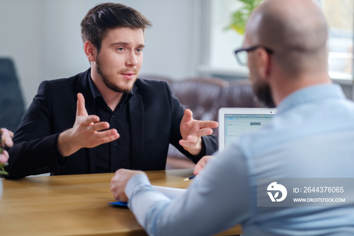 Confident young man attending job interview