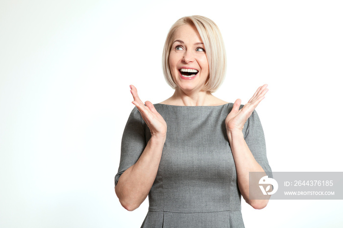 Surprised woman over white background. Human face expression, emotions, feeling attitude reaction