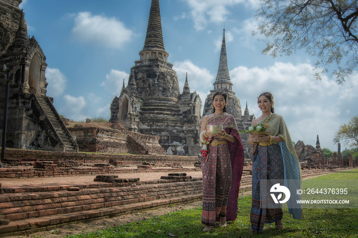 two women in traditional clothes. Beauty fantasy Thai women. Beautiful Thai girl in traditional dress costume ,Ayutthaya, Thailand. Asian women wearing traditional Thai culture, vintage style, Thai.