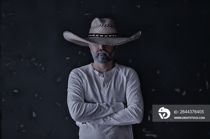 stern cowboy in a hat with brim, straw, retro vintage style, angry man wild west western