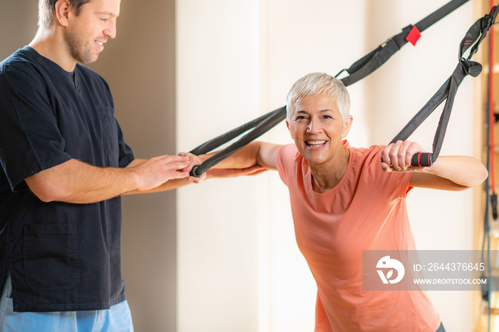 Senior Woman Exercising on TRX