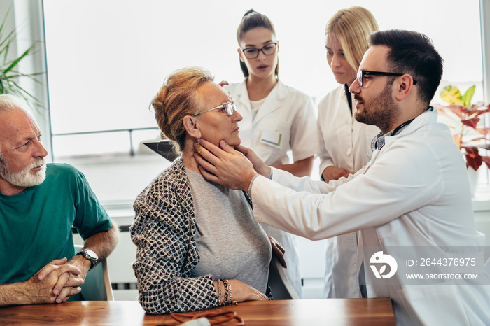 Group of young doctor during home visit senior people