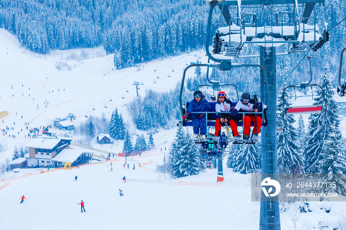 backlit scenes with ski lift chairs on hillside, Levi ski resort, Finland