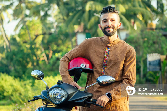 indian man wear helmet and ready to driving explore india attractions of Goa