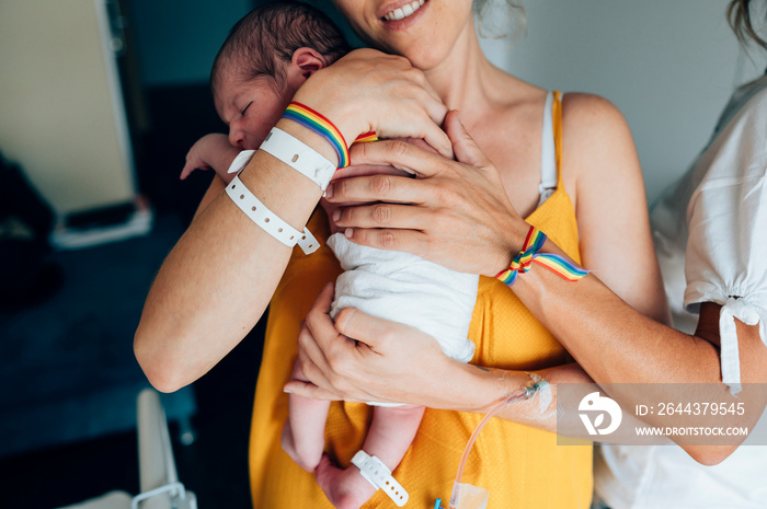 Two lesbian women with a newborn at the hospital