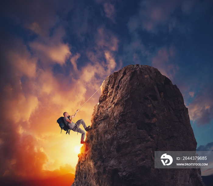 Businessman climb a mountain to get the flag. Achievement business goal and difficult career concept