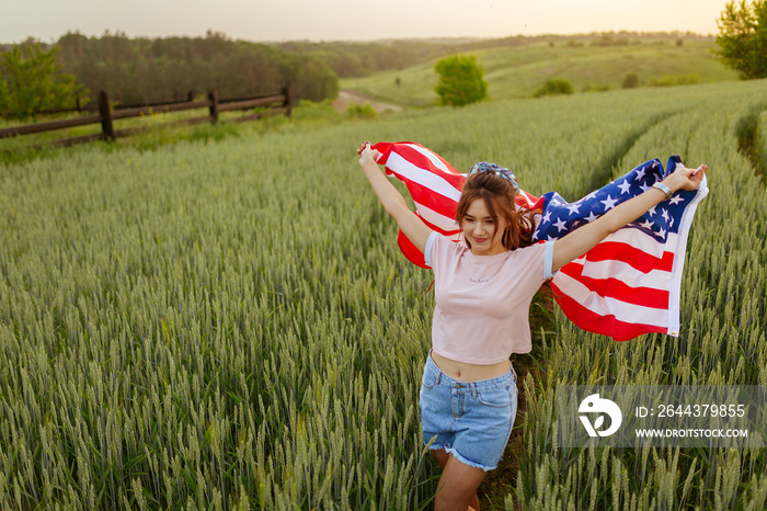 Independence day concept with woman holding american flag